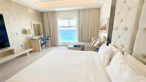 Bed, Seating area, Bedroom, Sea view