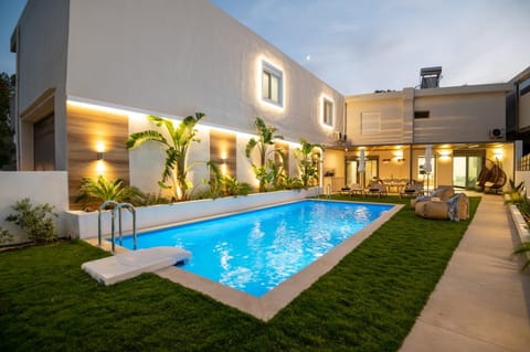 Property building, Night, Garden, Swimming pool, Swimming pool, sunbed