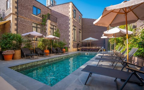 Property building, Day, Pool view, Swimming pool, sunbed