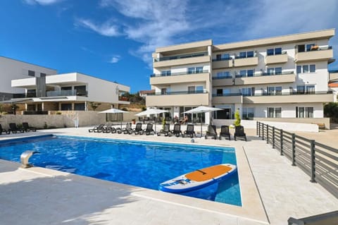 Property building, Swimming pool, Swimming pool, sunbed