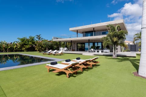 Property building, Patio, Spring, Day, Garden, Living room, Seating area, Garden view, Pool view, Swimming pool, sunbed