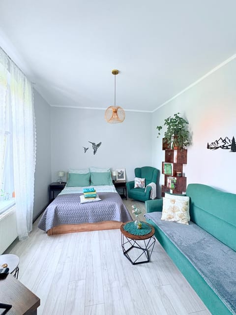Bed, Living room, Seating area, Bedroom