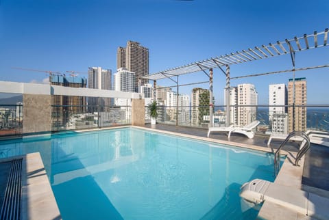 Property building, Beach, Swimming pool, sunbed