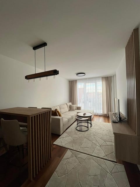 Bed, TV and multimedia, Living room, Seating area, air conditioner