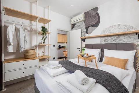 Bed, Bedroom, towels, air conditioner
