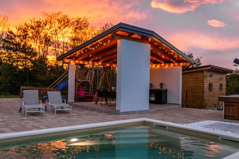 Property building, View (from property/room), Pool view, Swimming pool, Sunset