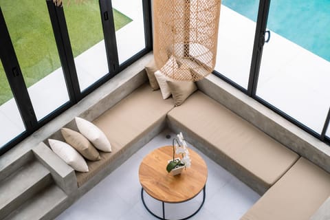 View (from property/room), Living room, Seating area, Pool view, Swimming pool