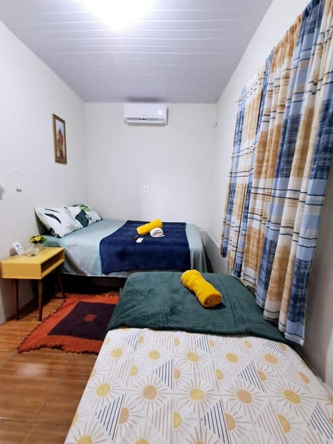 Photo of the whole room, towels, air conditioner