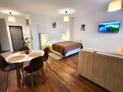 Communal lounge/ TV room, Bed, Seating area