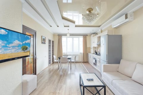 TV and multimedia, Kitchen or kitchenette, Living room, Seating area, Dining area, oven, stove, air conditioner