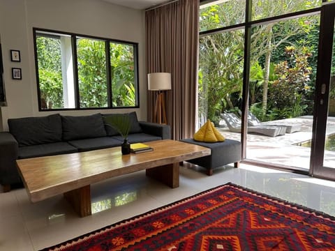Living room, Seating area, Garden view, Pool view