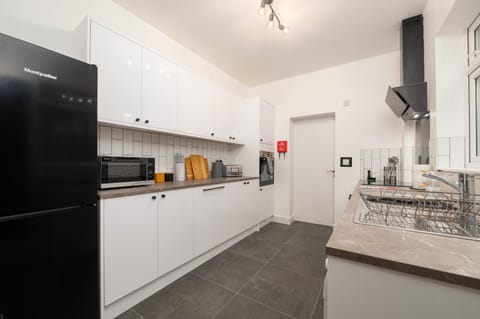 Kitchen or kitchenette, dishwasher, oven, stove, toaster