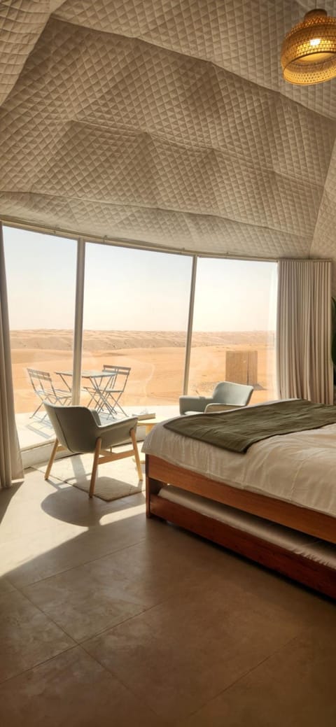 Bed, Living room, Seating area, Bedroom