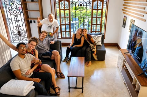 Communal lounge/ TV room, People, TV and multimedia, Living room, Seating area, Evening entertainment, group of guests, Family