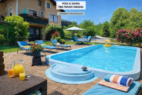 Property building, Patio, Day, Natural landscape, Balcony/Terrace, Garden view, Pool view, Swimming pool, sunbed