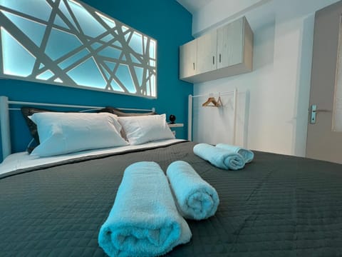 Bed, towels, wardrobe