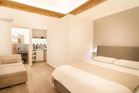 Bed, Living room, Seating area, Bedroom