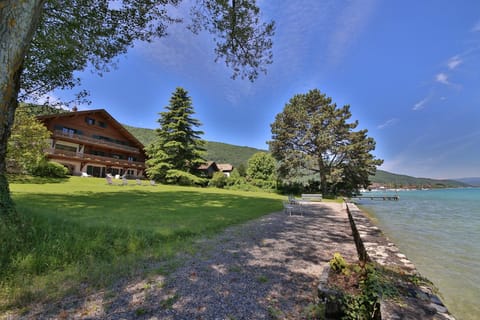 Property building, Nearby landmark, Spring, Day, Natural landscape, Beach, Lake view, Mountain view