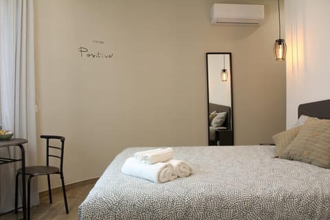 Bed, towels, air conditioner