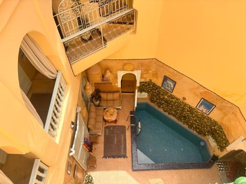 Patio, Living room, Seating area, Pool view, Swimming pool