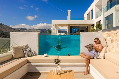 Property building, Patio, People, Natural landscape, Seating area, Guests, Mountain view, Pool view, Swimming pool, group of guests, sunbed