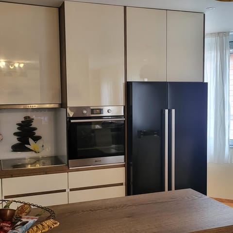 Kitchen or kitchenette, dishwasher, oven, stove