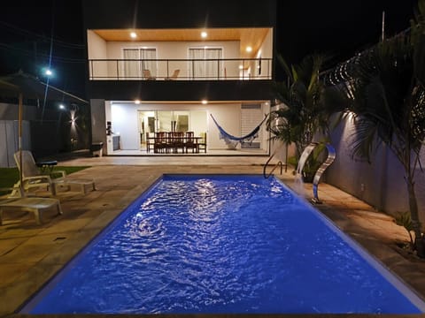 Property building, Patio, Night, Pool view, Swimming pool, sunbed