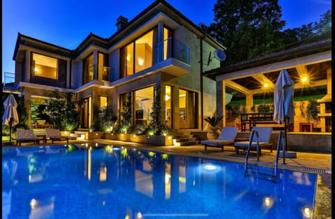 Property building, Patio, Night, Pool view, Swimming pool, sunbed