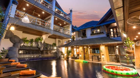 Property building, Patio, Night, Natural landscape, Pool view, Swimming pool