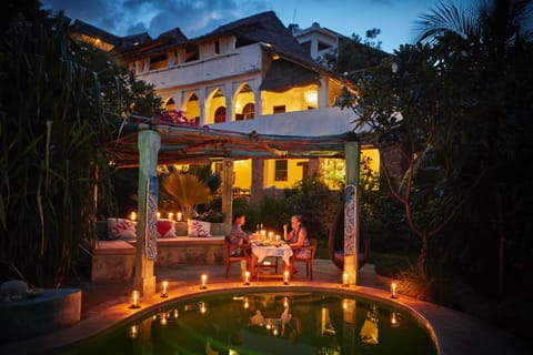 Property building, Patio, Night, People, Bird's eye view, Swimming pool, Internal: Not applicable to any particular room
