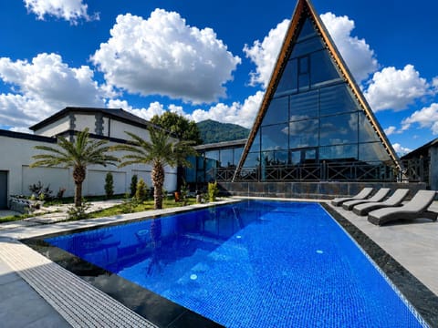Property building, Patio, Day, Natural landscape, Mountain view, Pool view, Swimming pool, sunbed