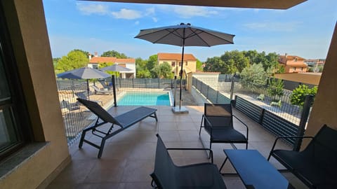 View (from property/room), Balcony/Terrace, Pool view, Swimming pool, sunbed