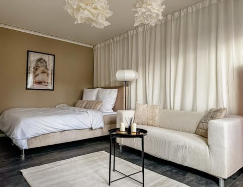 Bed, Living room, Seating area, Bedroom
