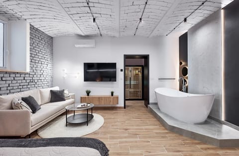 Sauna, TV and multimedia, Living room, Seating area, Bath, air conditioner