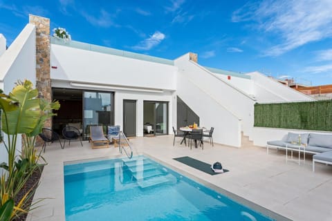 Property building, Day, Pool view, Swimming pool, sunbed