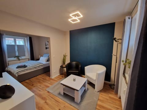 Bed, TV and multimedia, Living room, Photo of the whole room, Seating area, Bedroom