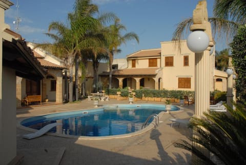 Property building, Patio, Pool view, Swimming pool, sunbed