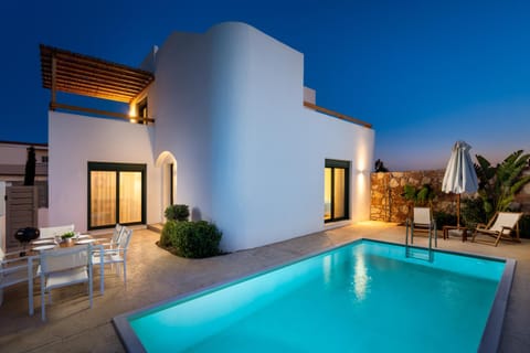 Property building, Patio, Natural landscape, Pool view, Swimming pool, sunbed