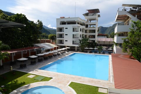 Property building, Day, Natural landscape, Mountain view, Pool view, Swimming pool, sunbed