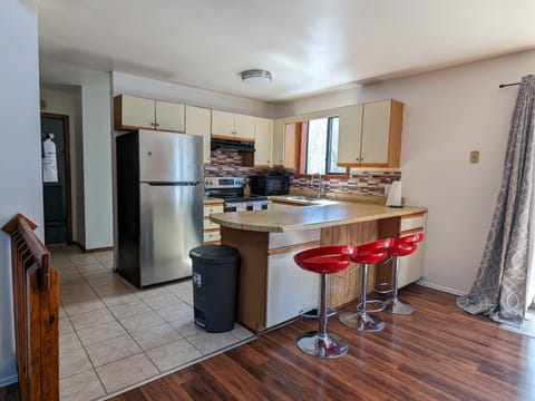 Kitchen or kitchenette, dishwasher, oven, stove