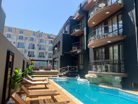 Property building, Patio, Day, View (from property/room), Balcony/Terrace, Evening entertainment, Pool view, Swimming pool, Swimming pool, sunbed