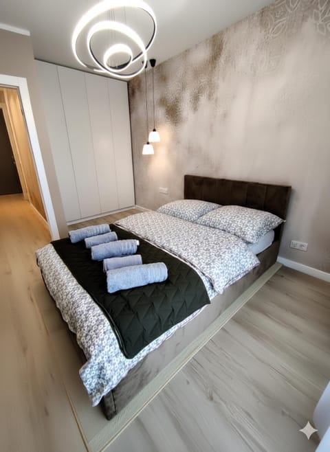 Bed, Seating area, Bedroom, hair dryier, locker, towels, wardrobe