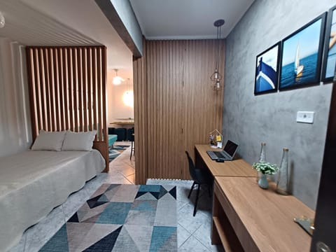 Bed, TV and multimedia, Living room, Seating area, Bedroom, hair dresser