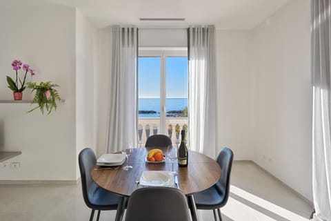 Natural landscape, Living room, Seating area, Dining area, Sea view