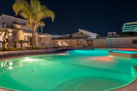 Property building, Night, Pool view, Swimming pool, sunbed