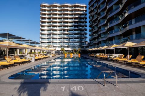 Property building, Day, Pool view, Swimming pool, sunbed