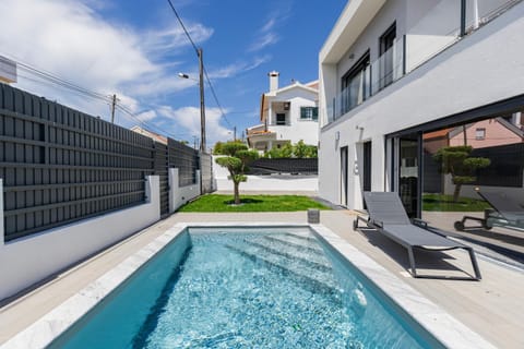 Property building, Pool view, Swimming pool, sunbed