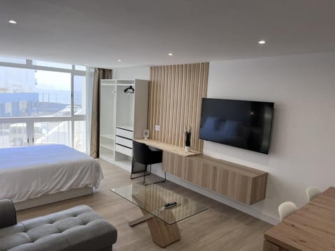 Communal lounge/ TV room, Bed, TV and multimedia, Living room, Photo of the whole room, Seating area, Bedroom