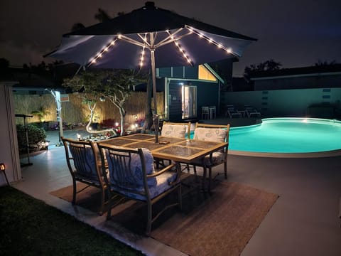 Patio, Night, Natural landscape, Dining area, Pool view, Swimming pool, sunbed