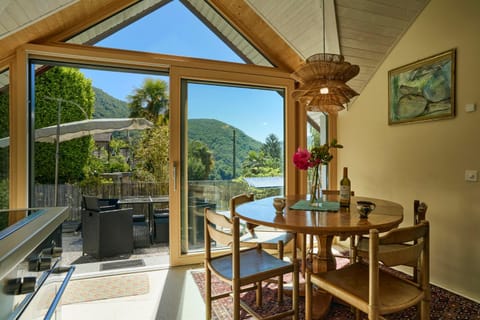 Patio, Day, View (from property/room), Living room, Seating area, Dining area, Mountain view